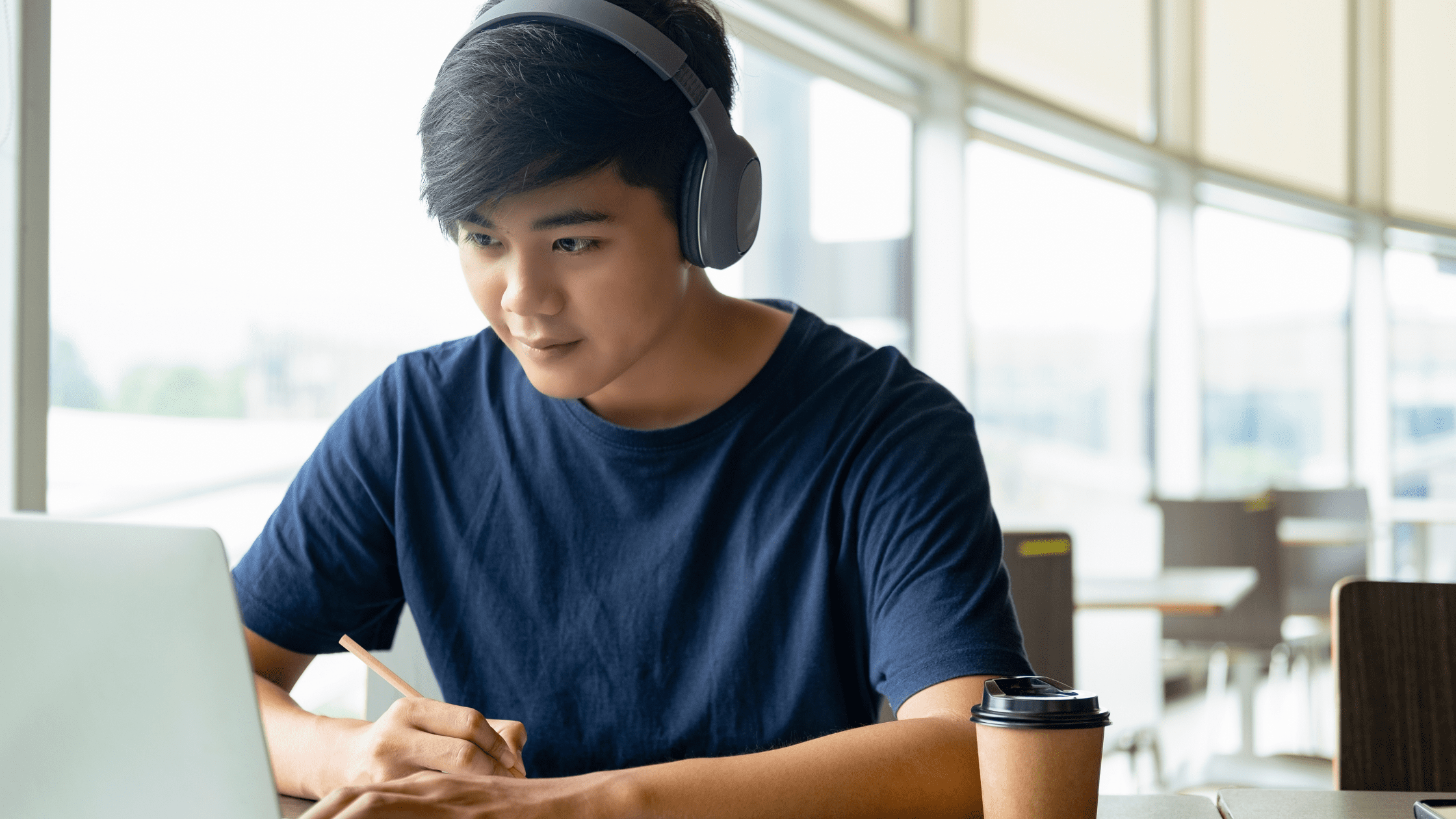 Medical school student studying for the USMLE using pathoma on his laptop.