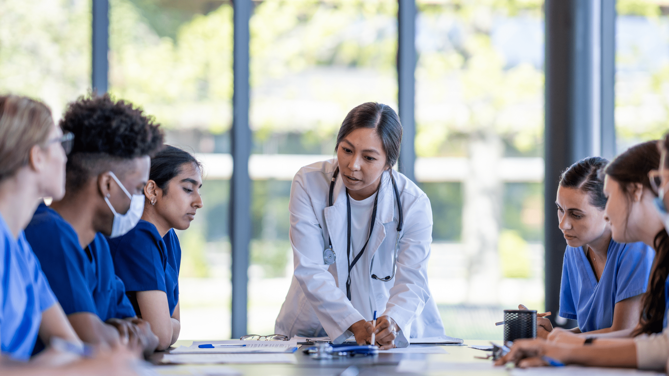 A group of medical school students in a classroom.