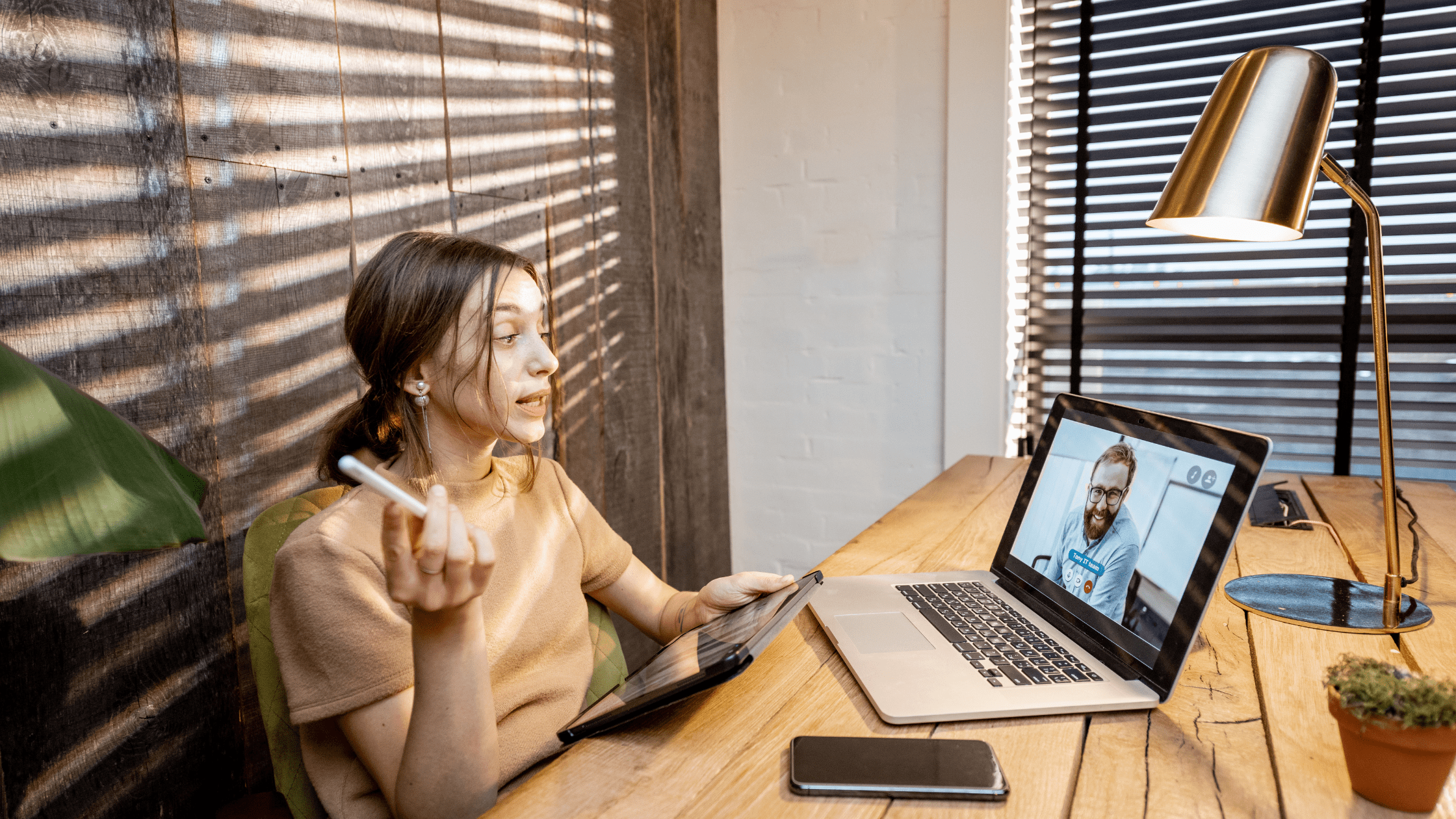 A medical residency applicant meeting with her advisor over a video chat meeting on her laptop.